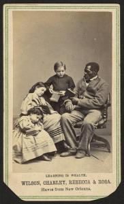 Learning is wealth. Wilson, Charley, Rebecca, and Rosa. Slaves from New Orleans  Charles Paxson, photographer c1864 1 photographic print on carte de visite mount : albumen ; 10 x 6 cm. Photograph shows Wilson Chinn, Charles Taylor, Rebecca Huger, and Rosina Downs, sitting, reading books Library of Congress